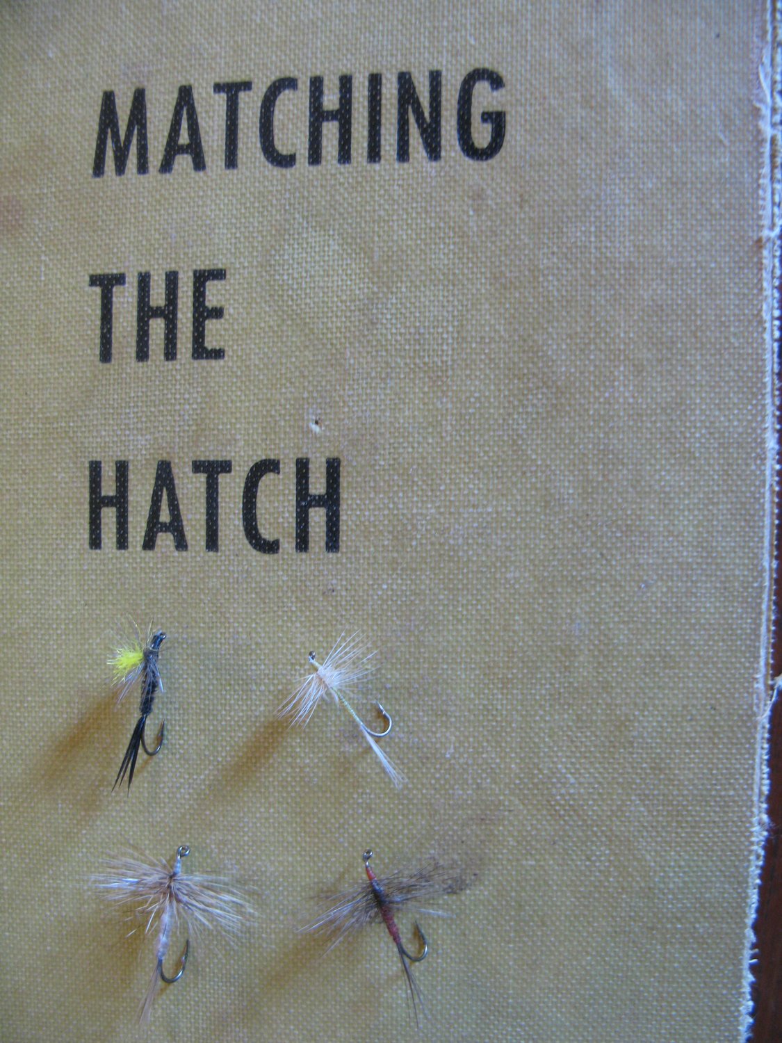The author's old copy of "Matching The Hatch," with the spinners and parachute flies he will fish in the future.